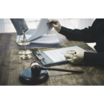 Legal scales and journal pages representing private enforcement in competition law