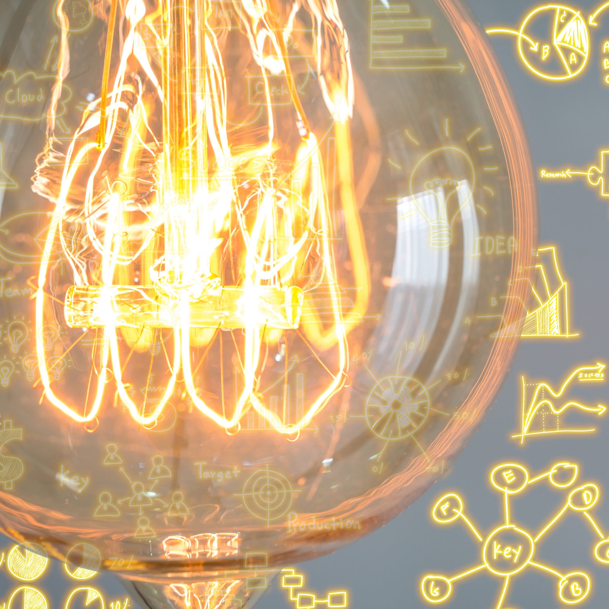 cropped light bulb with business diagrams background scaled